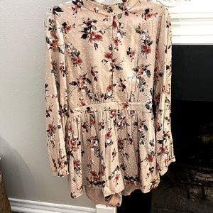 Pink floral long sleeve romper.